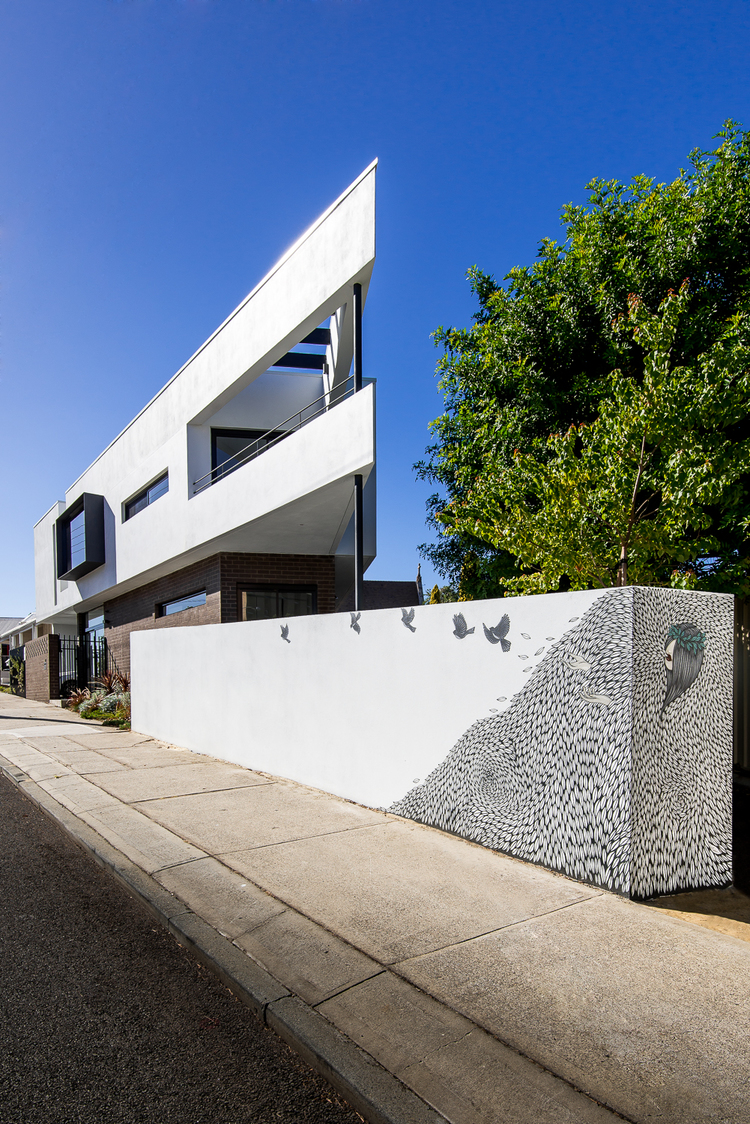 The stunning triangular form juts out with supercool artwork below at street level by Robert Jenkins. Local heroes: Triangle House by Robeson Architects. Image by Dion Photography. Vincent St, Mt. Lawley. Perth Residential Architecture. 