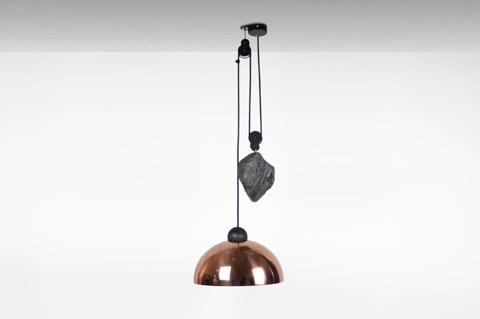 The Up-Down light by Jonathan Ben-Tovim is a contemporary twist on the classic industrial-age height-adjustable pendant light. The stainless steel shade comes in either an acid etched black or electroplated copper, with a natural pine detail. The counter weights are either natural Obsidian volcanic glass or shaped river stone. More VIVID #lighting #designers on the RSD Blog.