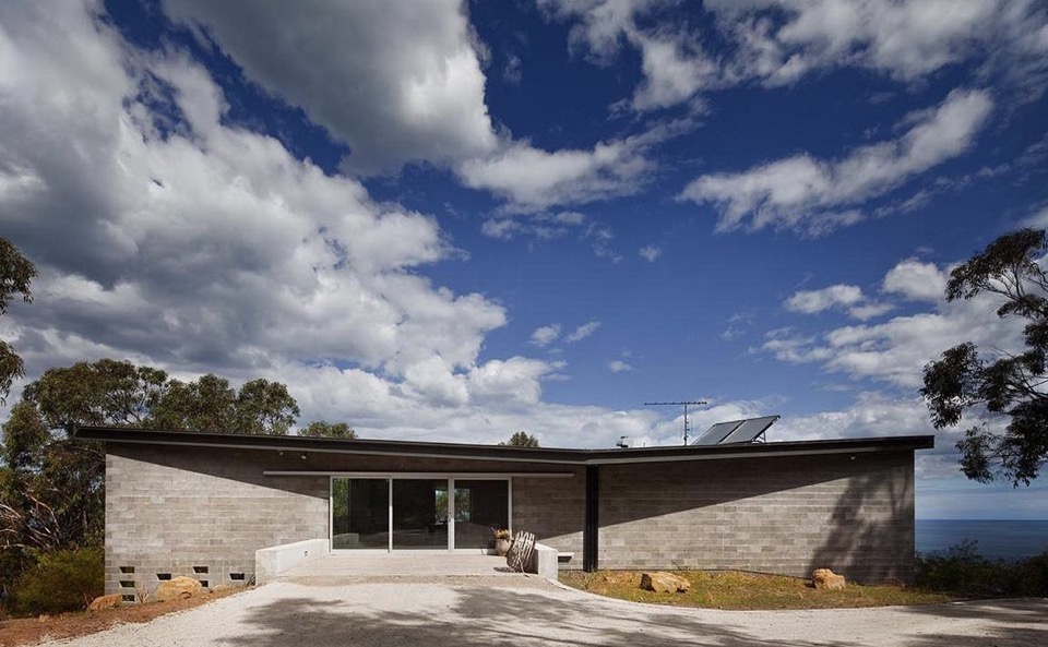 The dark roof form helps blend the house into the bush landscape. Exterior. House at Big Hill by Kerstin Thompson Architects. Australian Architecture.