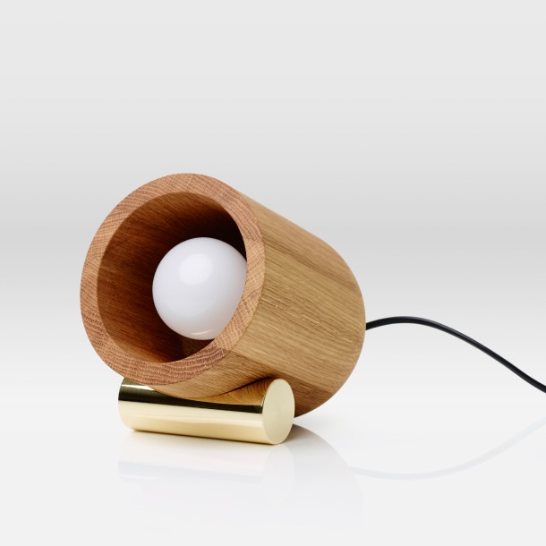 Co-Depend lamp by Nooko & Co, made up of curved American Oak body on a solid brass bar